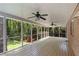 Large screened-in porch features wooded views, ceiling fans, and classic design at 2350 Powers Ferry Se Dr, Marietta, GA 30067