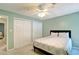 This bedroom features plush carpet, ceiling fan and two closets for ample storage at 4095 Stillwater Dr, Duluth, GA 30096