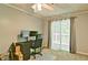Neutral bedroom features a workspace, natural light and view to outdoor scenery at 4095 Stillwater Dr, Duluth, GA 30096