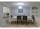 Cozy dining room featuring stylish chandelier lighting and built-in shelving for storage or decor at 4095 Stillwater Dr, Duluth, GA 30096