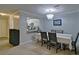 Inviting dining area features a chandelier and pass-through to the kitchen with granite countertops at 4095 Stillwater Dr, Duluth, GA 30096