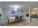 Open-concept dining room featuring a modern chandelier and seamless transition to the living area at 4095 Stillwater Dr, Duluth, GA 30096