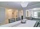 Dining space with modern chandelier and partial view into kitchen featuring sleek countertops at 4095 Stillwater Dr, Duluth, GA 30096