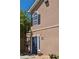 Exterior facade of a brick building featuring a dark blue front door, window and dark shutters at 4095 Stillwater Dr, Duluth, GA 30096
