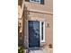 This is the home's entrance, featuring a glass window and neutral brick at 4095 Stillwater Dr, Duluth, GA 30096