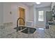 A modern kitchen view with stainless steel appliances, granite countertop, and gray walls at 4095 Stillwater Dr, Duluth, GA 30096