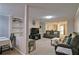 Spacious living room featuring built-in shelving and an adjoining dining area for entertaining at 4095 Stillwater Dr, Duluth, GA 30096