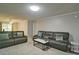 An oversized living room features two couches, a coffee table and plush carpet at 4095 Stillwater Dr, Duluth, GA 30096