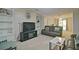 Spacious living room with built-in shelving, fireplace and a view of the dining area at 4095 Stillwater Dr, Duluth, GA 30096