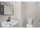 Modern powder room features a new sink, mirror, and fixtures at 612 Windcroft Nw Cir, Acworth, GA 30101