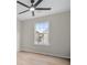 Neutral bedroom with natural light, ceiling fan, and modern flooring at 612 Windcroft Nw Cir, Acworth, GA 30101