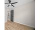 Neutral bedroom with modern flooring and fan light combo at 612 Windcroft Nw Cir, Acworth, GA 30101