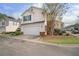 View of home featuring attached two-car garage and neutral siding at 612 Windcroft Nw Cir, Acworth, GA 30101