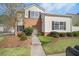 Charming two-story townhome with landscaped front yard and neutral siding at 612 Windcroft Nw Cir, Acworth, GA 30101
