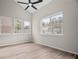 Bright living room features large windows and wood flooring at 612 Windcroft Nw Cir, Acworth, GA 30101