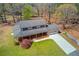 Aerial view of a two-story home with a covered porch, large lot, and an attached garage at 692 W Union Grove Cir, Auburn, GA 30011