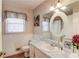 Classic bathroom featuring tile accents, ample counter space, and a large mirror for a luxurious feel at 692 W Union Grove Cir, Auburn, GA 30011