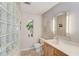 Bathroom features glass block wall, vanity, and neutral color scheme at 692 W Union Grove Cir, Auburn, GA 30011