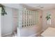 Bathroom with a glass block divider wall and tiled floors at 692 W Union Grove Cir, Auburn, GA 30011