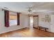 Bedroom with hardwood floors, ceiling fan, window, and sliding shoji screen closet at 692 W Union Grove Cir, Auburn, GA 30011