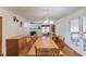 This dining room features a long wooden table, hardwood floors, and a fireplace, perfect for Gathering gatherings at 692 W Union Grove Cir, Auburn, GA 30011