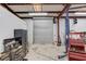 Spacious garage interior featuring storage and garage door at 692 W Union Grove Cir, Auburn, GA 30011