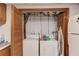 Laundry room with washer, dryer and cabinets at 692 W Union Grove Cir, Auburn, GA 30011