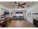 Spacious living room with hardwood floors, a decorative fireplace, and comfortable seating at 692 W Union Grove Cir, Auburn, GA 30011
