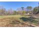 Vast grassy lot featuring mature trees in a serene, natural setting at 692 W Union Grove Cir, Auburn, GA 30011