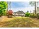 Expansive backyard featuring a well-maintained lawn and covered patio at 717 Robinson Farms Dr, Marietta, GA 30068