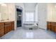 Relaxing bathroom with dual vanities, separate tub, and enclosed shower at 717 Robinson Farms Dr, Marietta, GA 30068