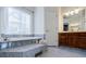 This bathroom features dual vanities, separate tub, enclosed shower, and lots of space at 717 Robinson Farms Dr, Marietta, GA 30068