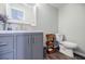 Modern bathroom features new vanity with stylish fixtures, marble countertop, and wood-look floor at 717 Robinson Farms Dr, Marietta, GA 30068