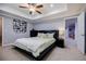 This cozy bedroom has a king size bed, decorative ceiling fan, and neutral tones at 717 Robinson Farms Dr, Marietta, GA 30068