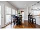 Bright dining space featuring a dark wood table, neutral decor, and lots of natural light at 717 Robinson Farms Dr, Marietta, GA 30068