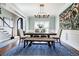 Dining area features a wooden table, bench, and staircase at 717 Robinson Farms Dr, Marietta, GA 30068