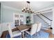 Open dining room with light blue walls and a dark wood table at 717 Robinson Farms Dr, Marietta, GA 30068
