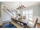 The dining room has a stylish light fixture, table, chairs, and a bench at 717 Robinson Farms Dr, Marietta, GA 30068