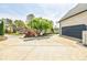 Long driveway leading to an attached garage, surrounded by manicured landscaping at 717 Robinson Farms Dr, Marietta, GA 30068