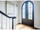 Bright foyer featuring hardwood floors and an elegant staircase at 717 Robinson Farms Dr, Marietta, GA 30068