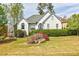 Charming home featuring a well-manicured lawn and lush landscaping at 717 Robinson Farms Dr, Marietta, GA 30068