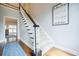 Foyer with staircase that leads to the second level, featuring a decorative wall sign at 717 Robinson Farms Dr, Marietta, GA 30068