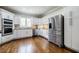 Stylish kitchen with white cabinets, stainless steel appliances, and granite countertops at 717 Robinson Farms Dr, Marietta, GA 30068