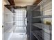 Functional laundry room with shelving, washer/dryer, and storage space at 717 Robinson Farms Dr, Marietta, GA 30068