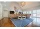 Spacious living room with hardwood floors, large sectional, and natural light at 717 Robinson Farms Dr, Marietta, GA 30068