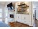 Living room features a stone fireplace with built-in shelving and cabinets at 717 Robinson Farms Dr, Marietta, GA 30068