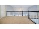 Spacious finished loft area with carpeting and decorative hanging light fixture at 717 Robinson Farms Dr, Marietta, GA 30068