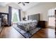 Vaulted ceilings, abundant natural light and en-suite bathroom highlight this main bedroom at 717 Robinson Farms Dr, Marietta, GA 30068