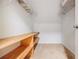 Bright walk-in closet features wood shelving and wire racks for ample storage space at 717 Robinson Farms Dr, Marietta, GA 30068