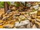 Unique backyard water feature with stone, water, and decorative turtle at 717 Robinson Farms Dr, Marietta, GA 30068